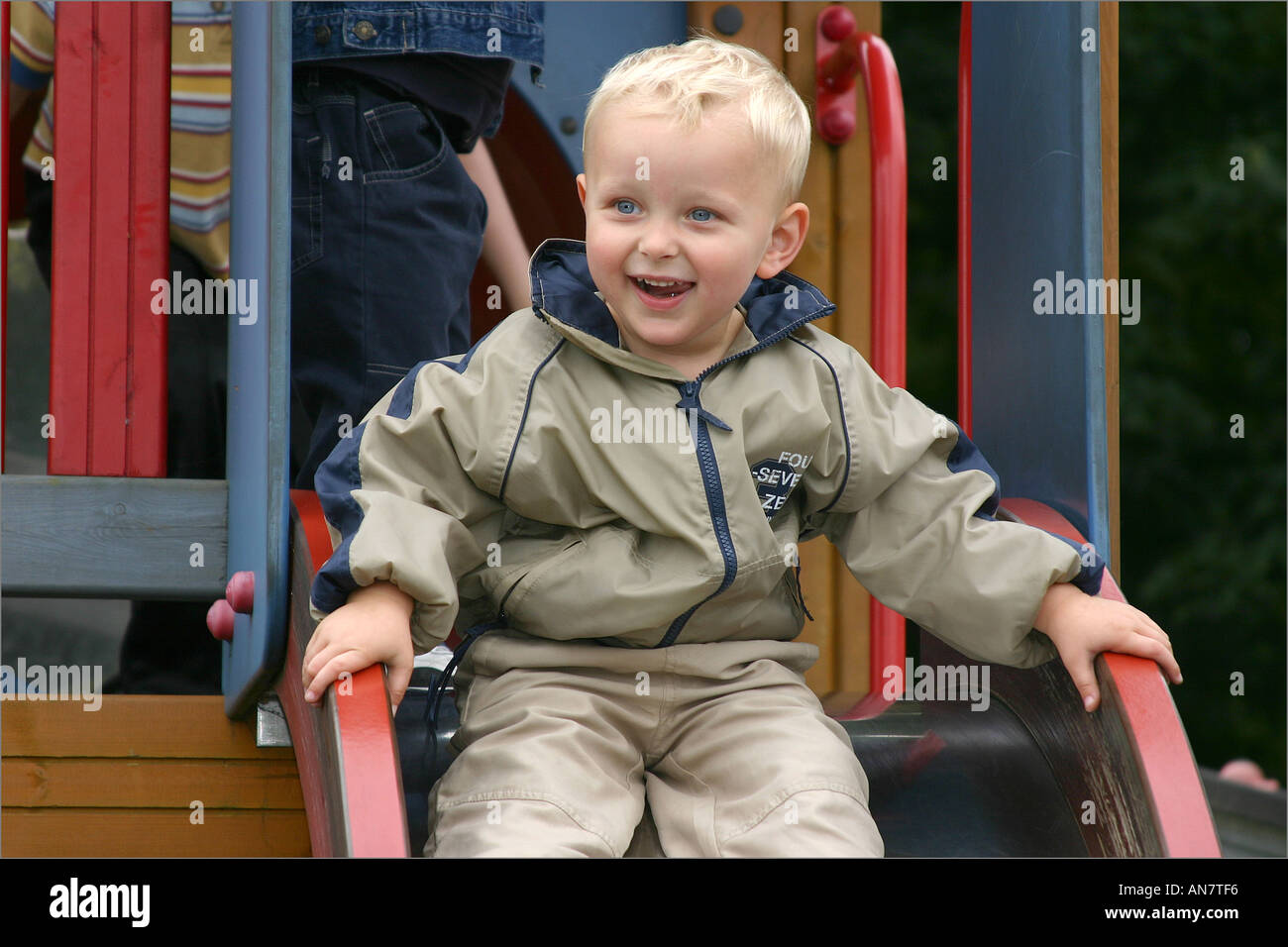 Hurt boy on playground hi-res stock photography and images - Alamy