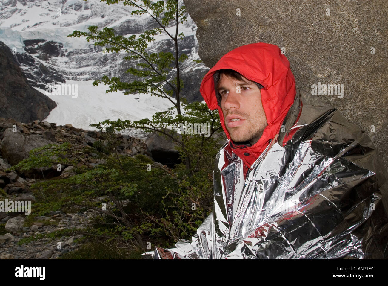Male Wrapped in Survival Foil Blanket Stock Photo