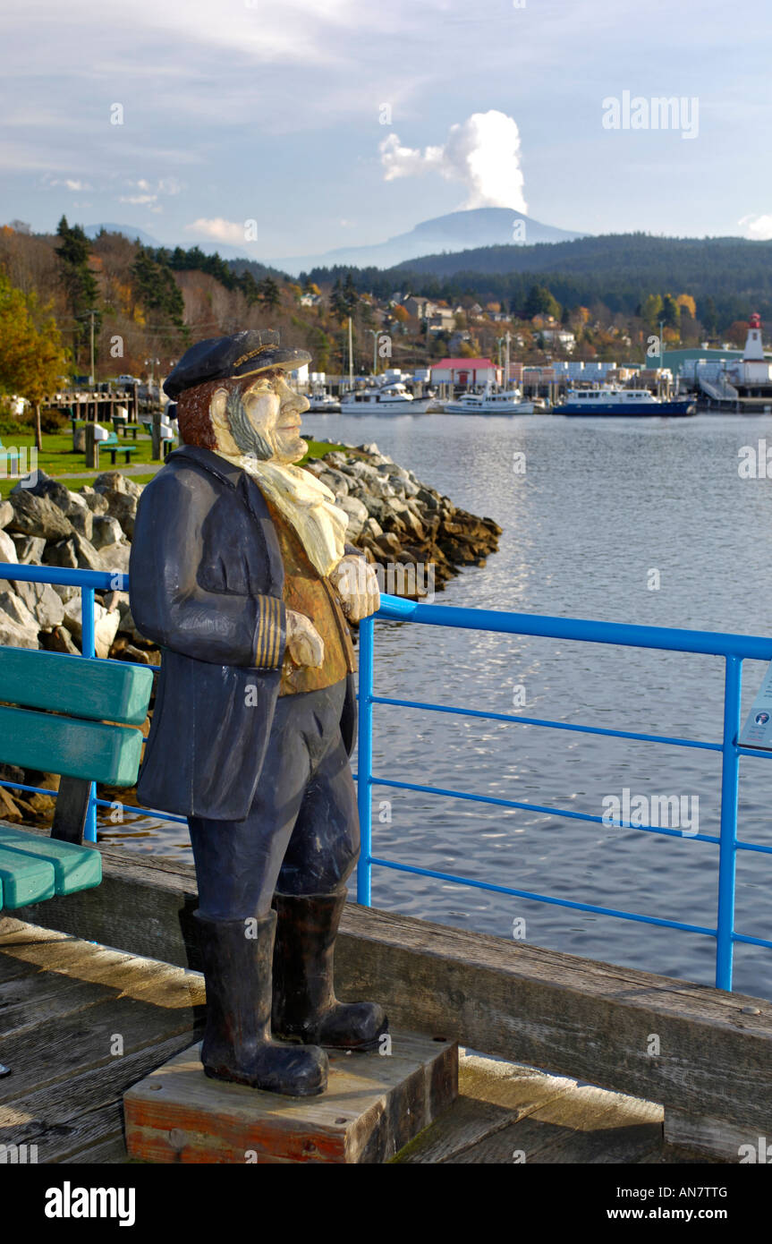 Wooden Carved Sculpture of and Old Seafarer on The Pier at Port Alberni Vancouver Island BC Canada Stock Photo