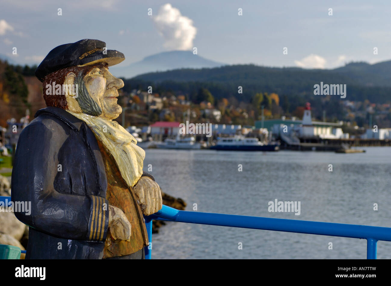 Wooden Carved Sculpture of and Old Seafarer on The Pier at Port Alberni Stock Photo