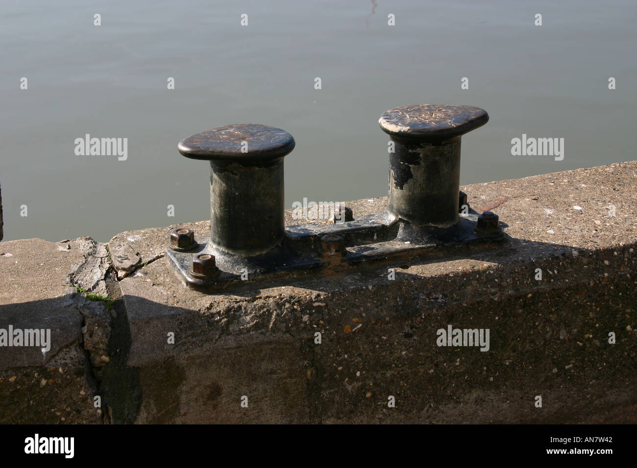 Old boat mooring bollards on the harbour side at Bridlington North Yorkshire Stock Photo