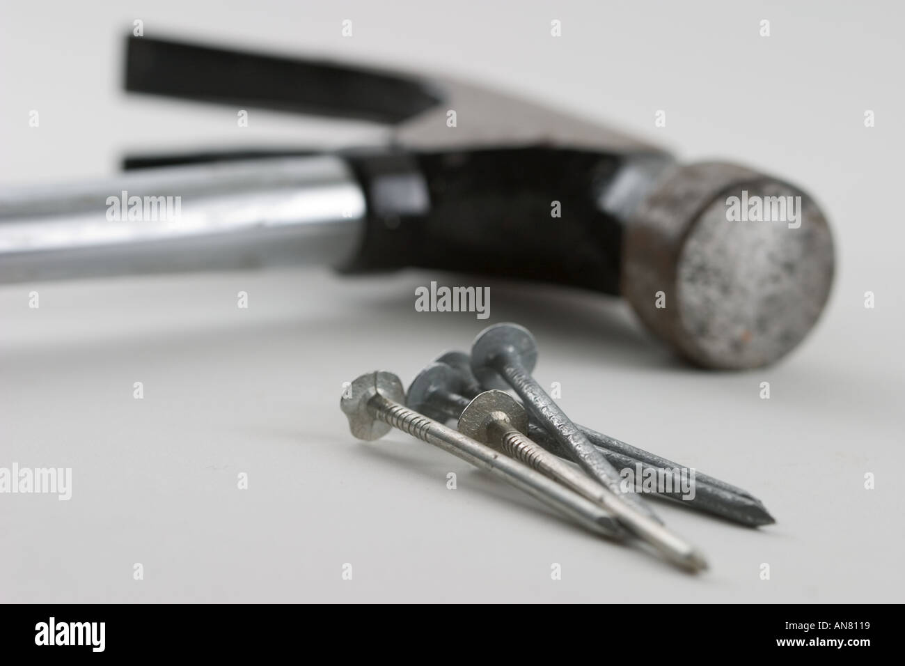 Five nails and hammer Stock Photo