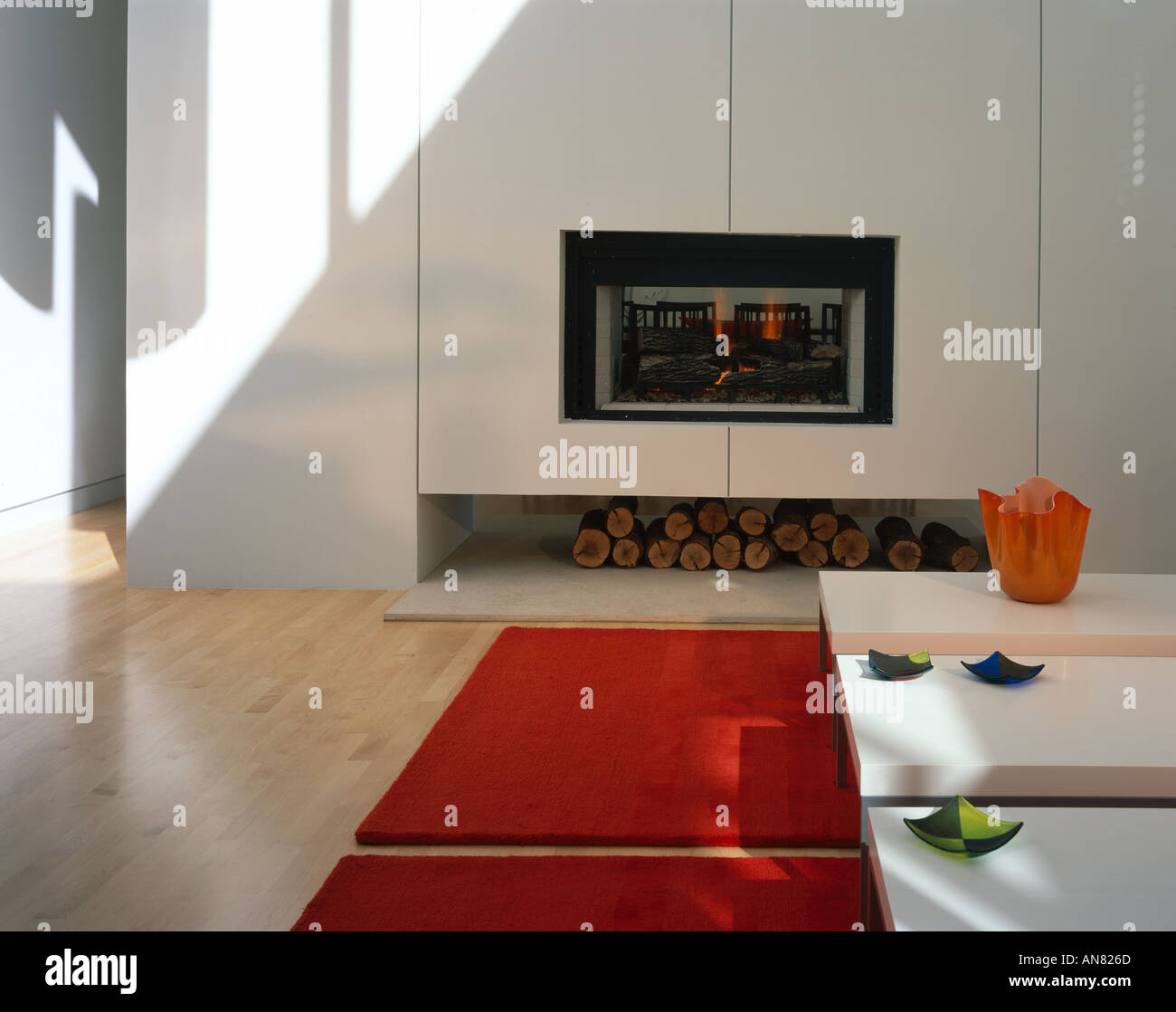 Oshry Residence, Bel Air, California. Lit fireplace in living area. Architect: SPF Architects Stock Photo