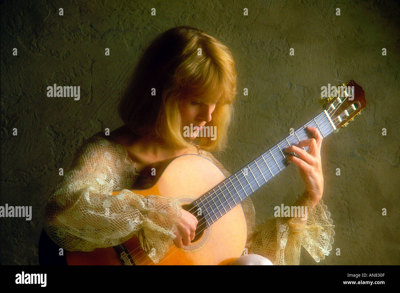 woman playing classical guitar Stock Photo - Alamy