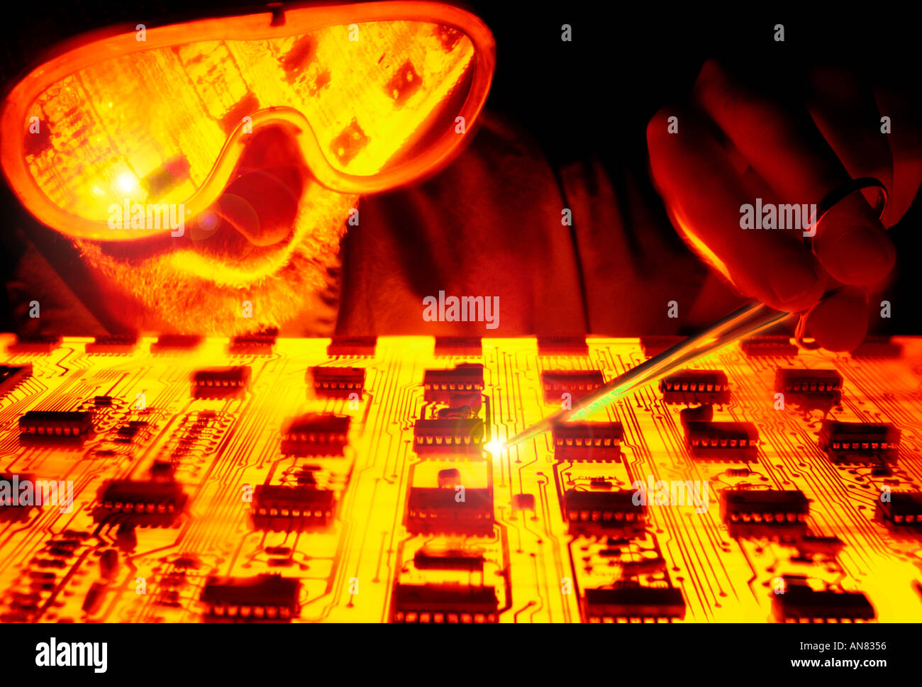 man working on circuit board Stock Photo