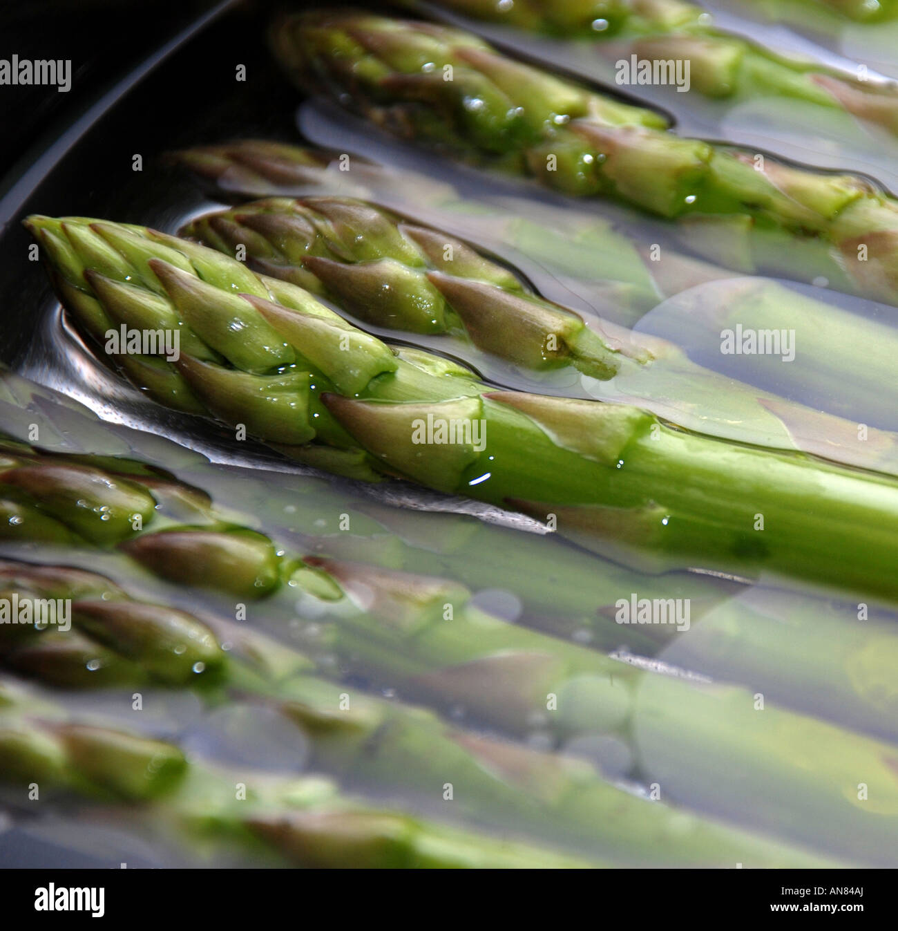 Boiling asparagus in water and oil stock photo alamy