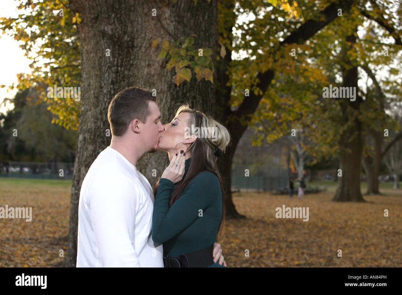 A husban kissing his wife young wife Stock Photo