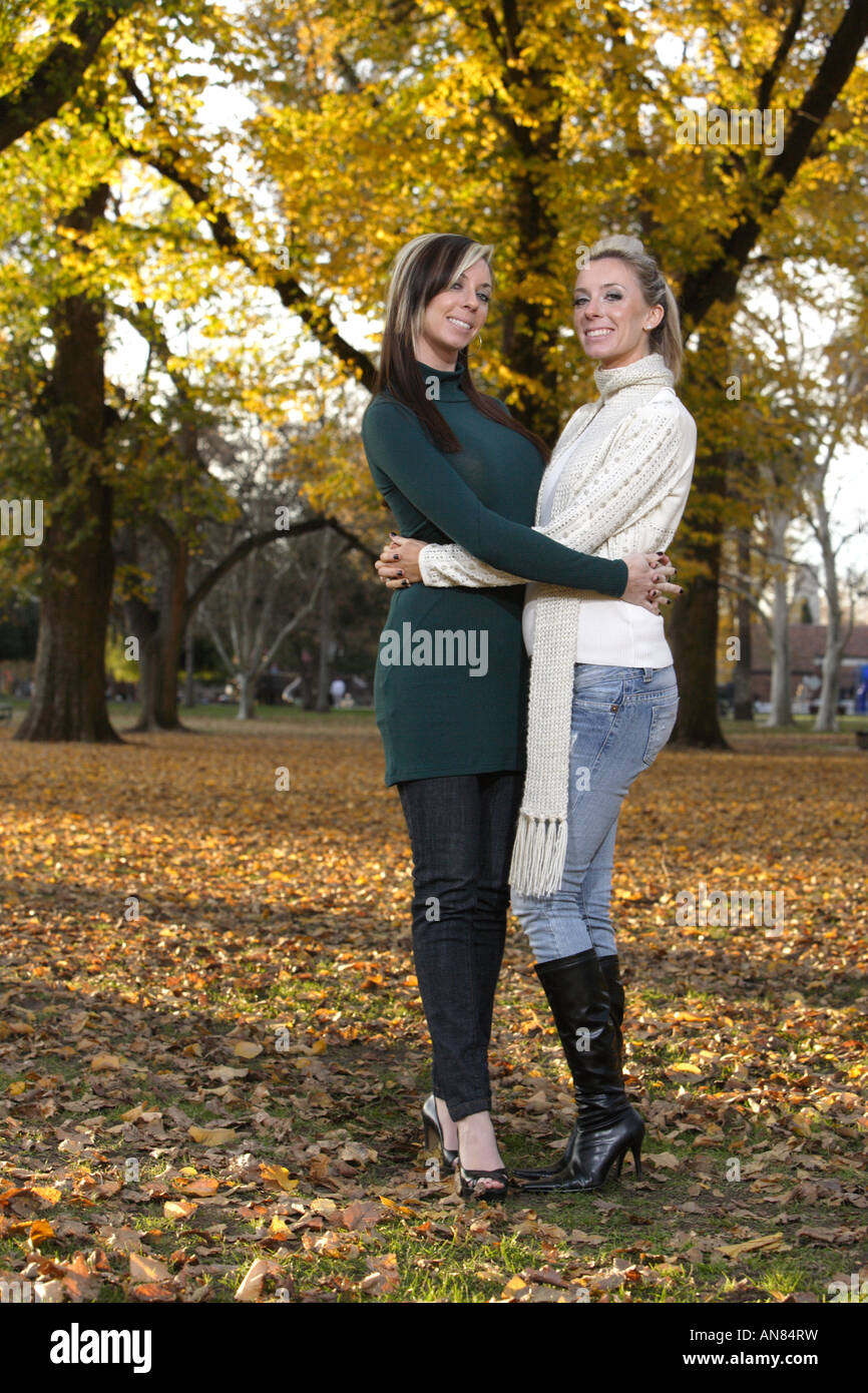 Two twin sisters at the park Stock Photo