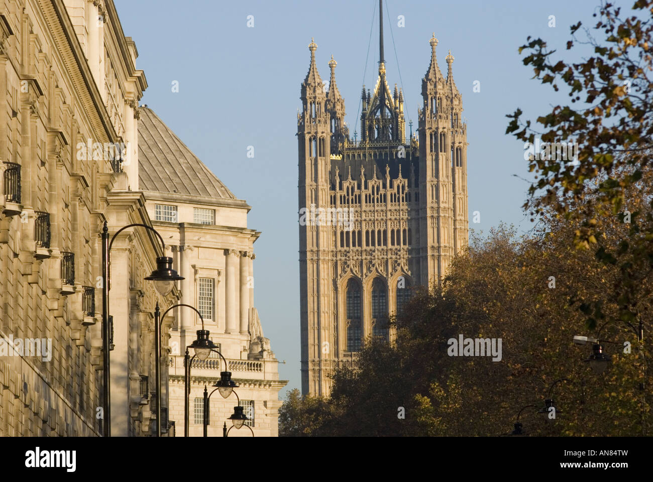 A row of street lights along Mill Bank with the Victoria Tower at the Houses of Parliment in the background, London, UK. Stock Photo