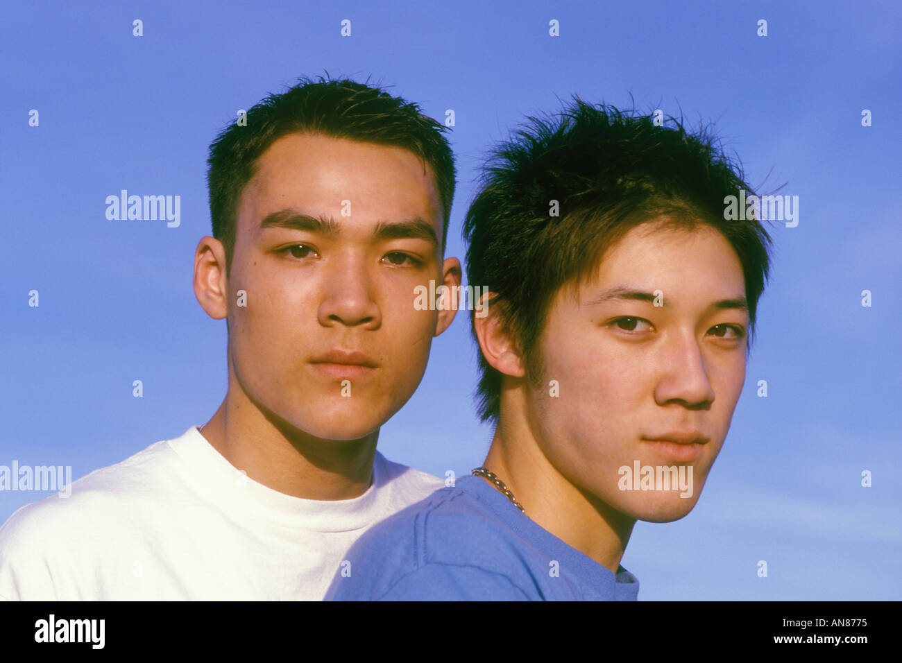 Portrait of 17 year old mixed Asian Caucasian male and 17 year old Asian  male Stock Photo - Alamy