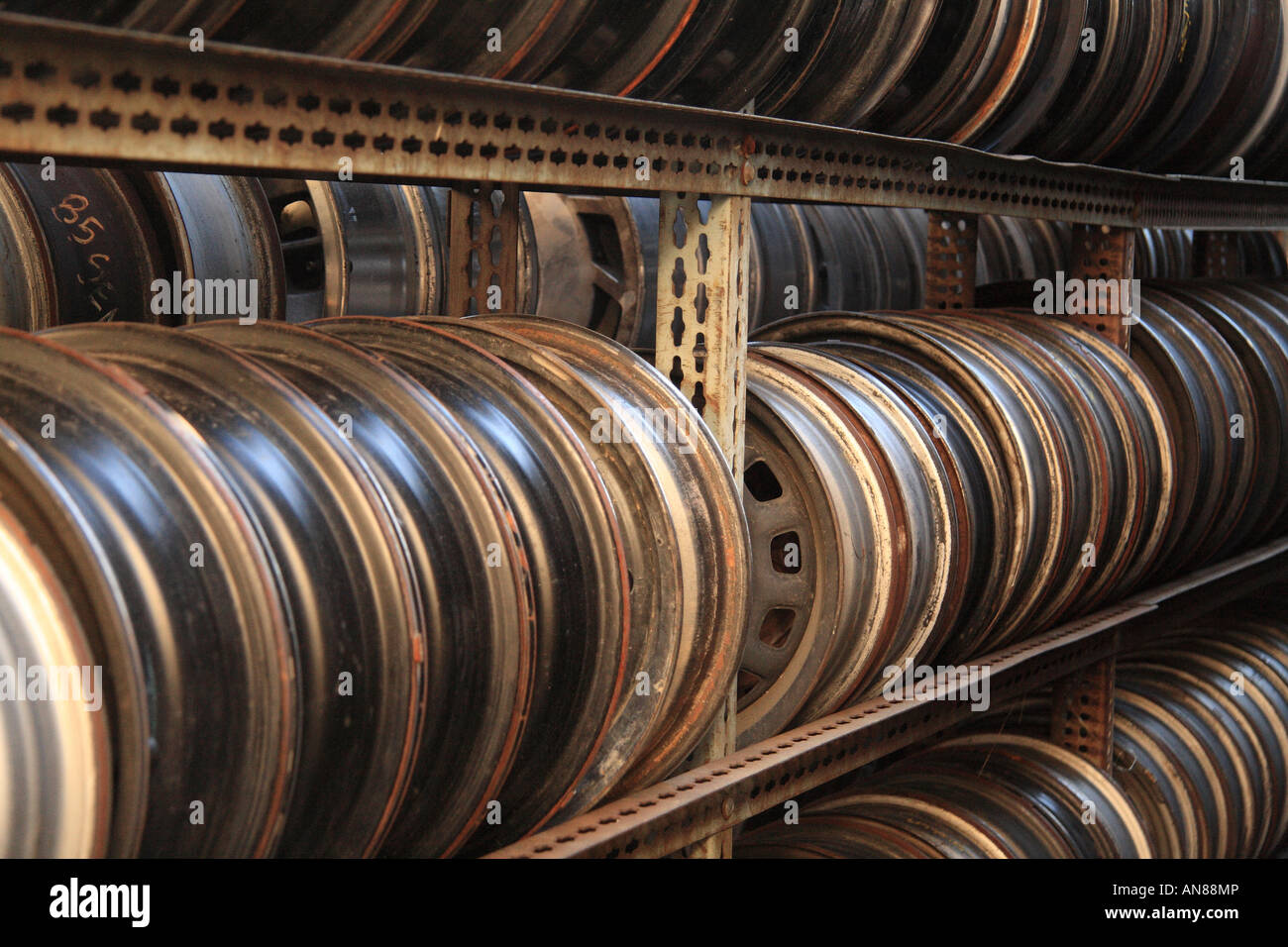 Rows of junkyard car wheels Stock Photo - Alamy