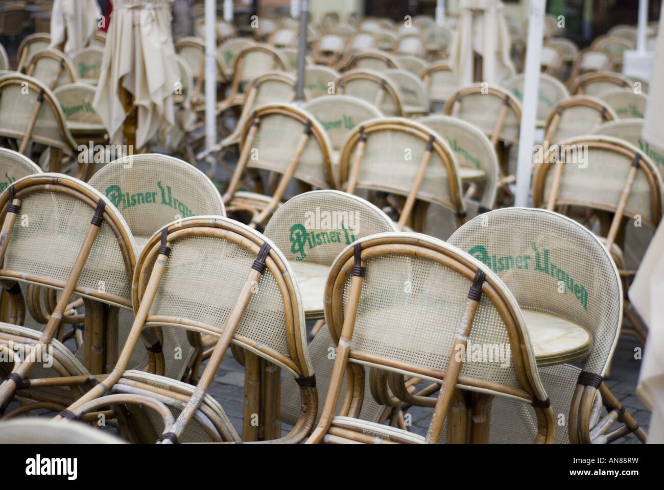 Chairs stacked against cafe tables in Prague's Old Town Square, Czech Republic. Stock Photo