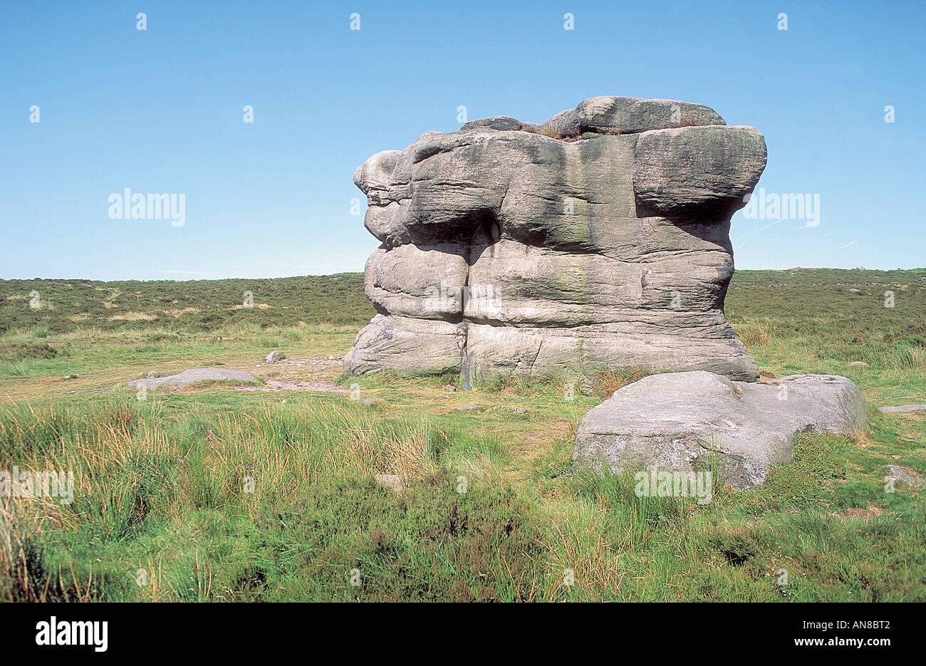 Eagle Stone sitting on moorland at the top of Baslow Edge in the Peak District Stock Photo