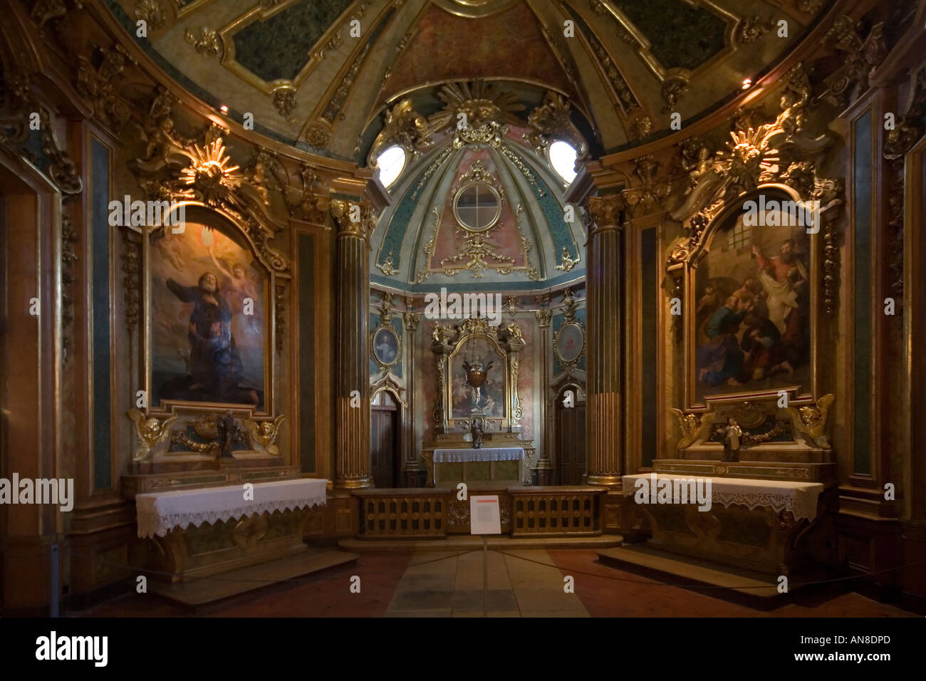 QUELUZ PORTUGAL Oil portraits of saints flank main altar in the chapel of the Palacio Nacional de Queluz The Queluz Palace Stock Photo