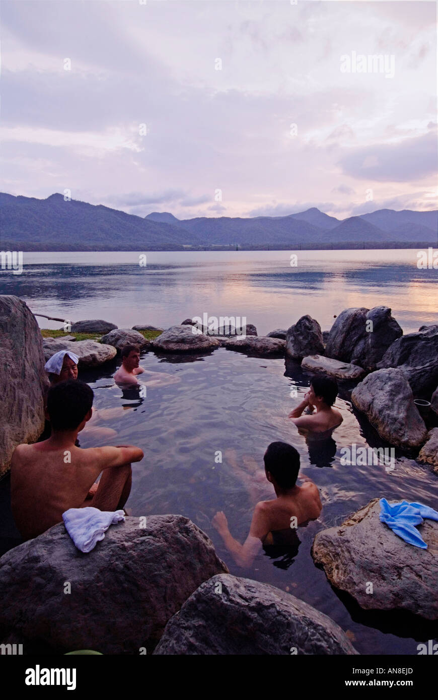 People bathing in outdoor rotemburo onsen on shore of Lake Akan in Akan National Park Hokkaido Stock Photo