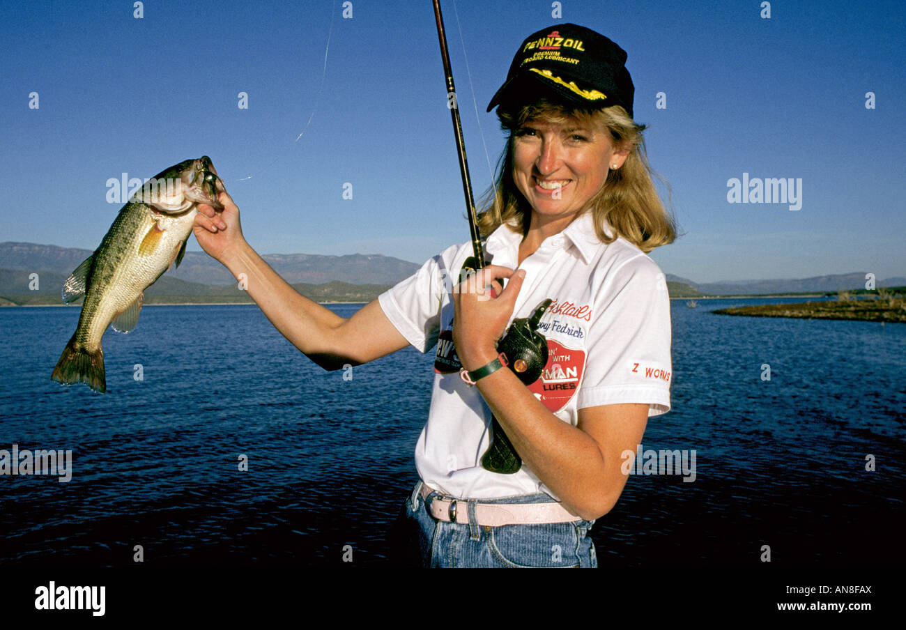 https://c8.alamy.com/comp/AN8FAX/a-woman-bass-fisherman-angler-in-an-expensive-bass-boat-fishes-for-AN8FAX.jpg