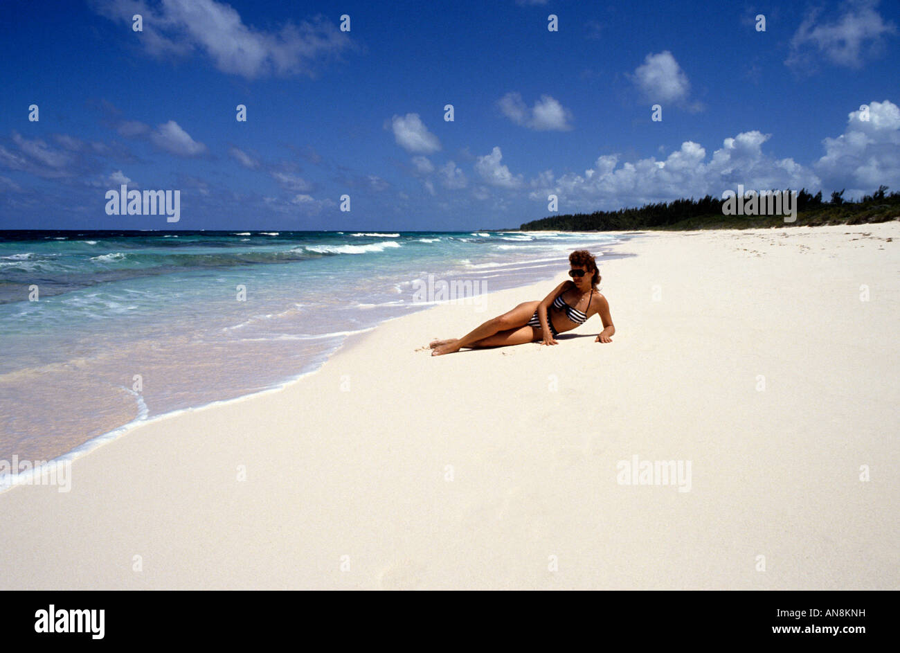 woman on Surfers Beach Eleuthera Bahamas Stock Photo