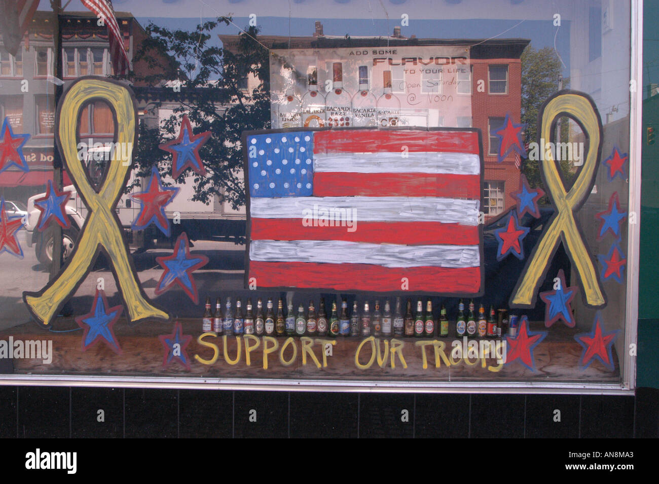 Beer flag and yellow ribbons tavern window Madison Indiana Stock Photo
