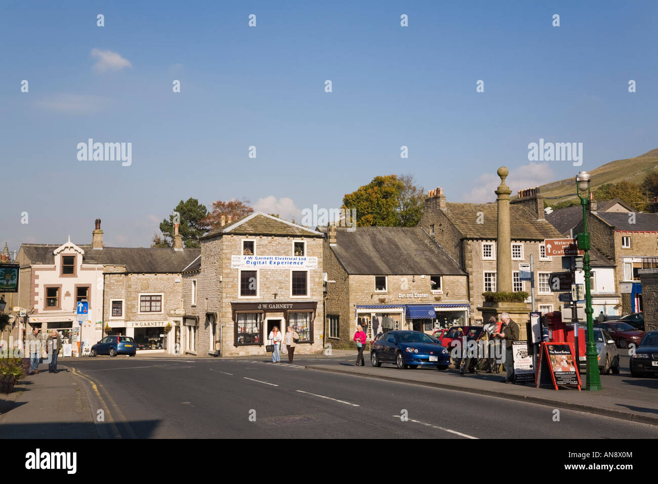 Traditional limestone buildings in historic town centre in 'Market Place' Settle Yorkshire England UK Stock Photo