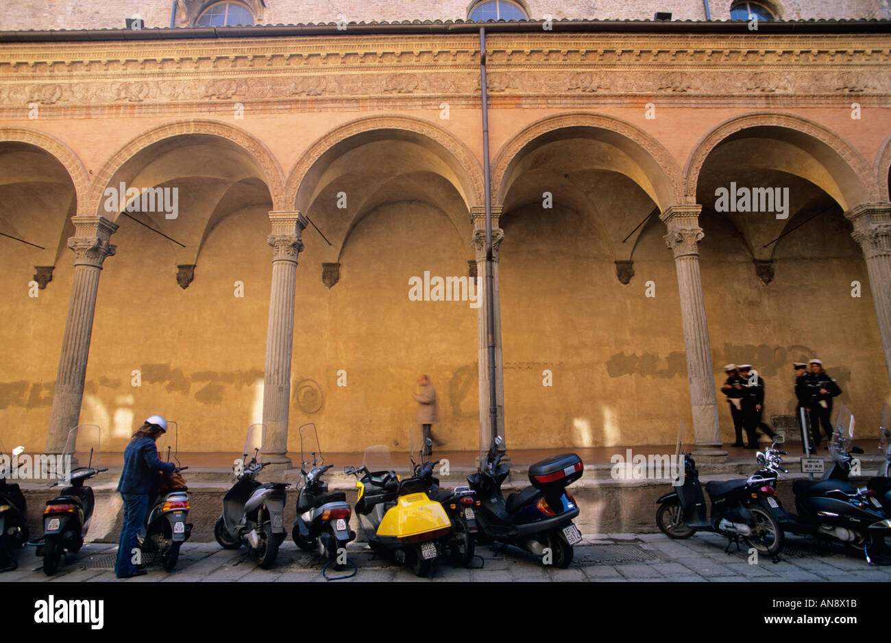 Motorbikes and porticoes Bologna Italy Stock Photo