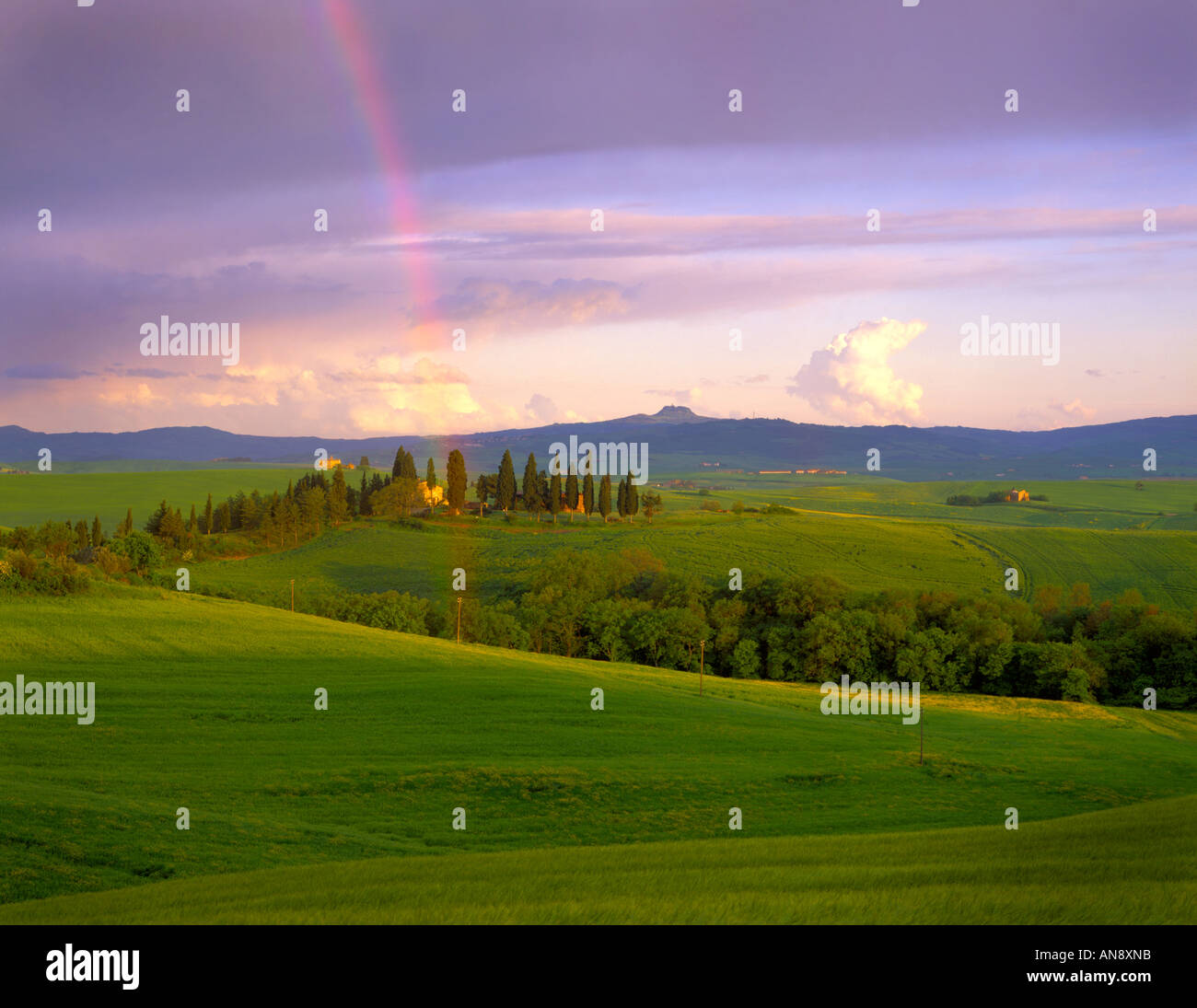 Tuscan sunset with rainbow in springtime in Italy Stock Photo