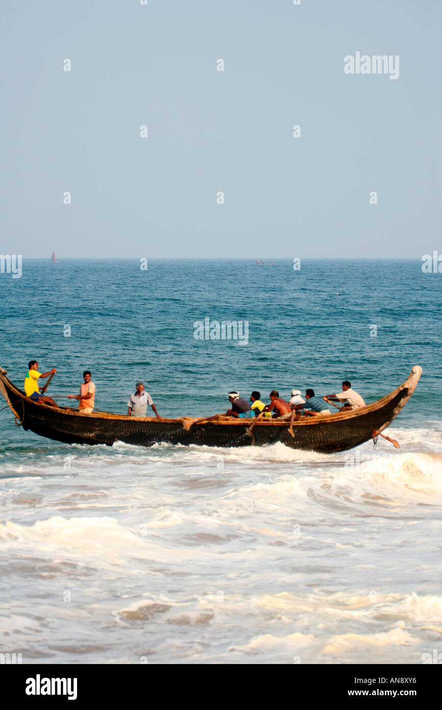 Fishermen on their in boat in Kerala India Stock Photo