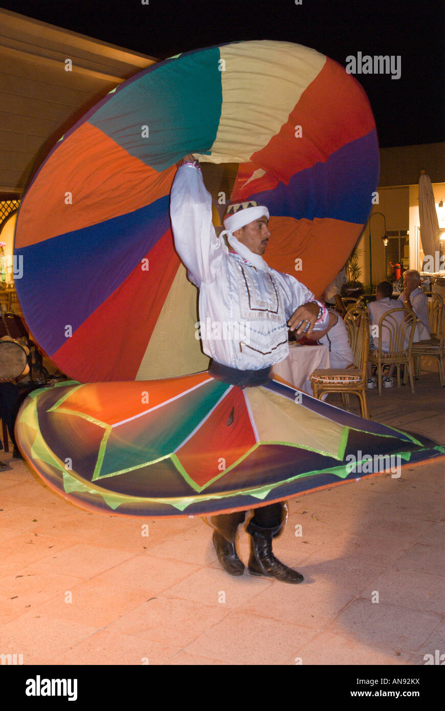 Egypt whirling dervish dancer entertains at Movenpick Jolie Ville hotel Crocodile Island on the Nile at Luxor Stock Photo
