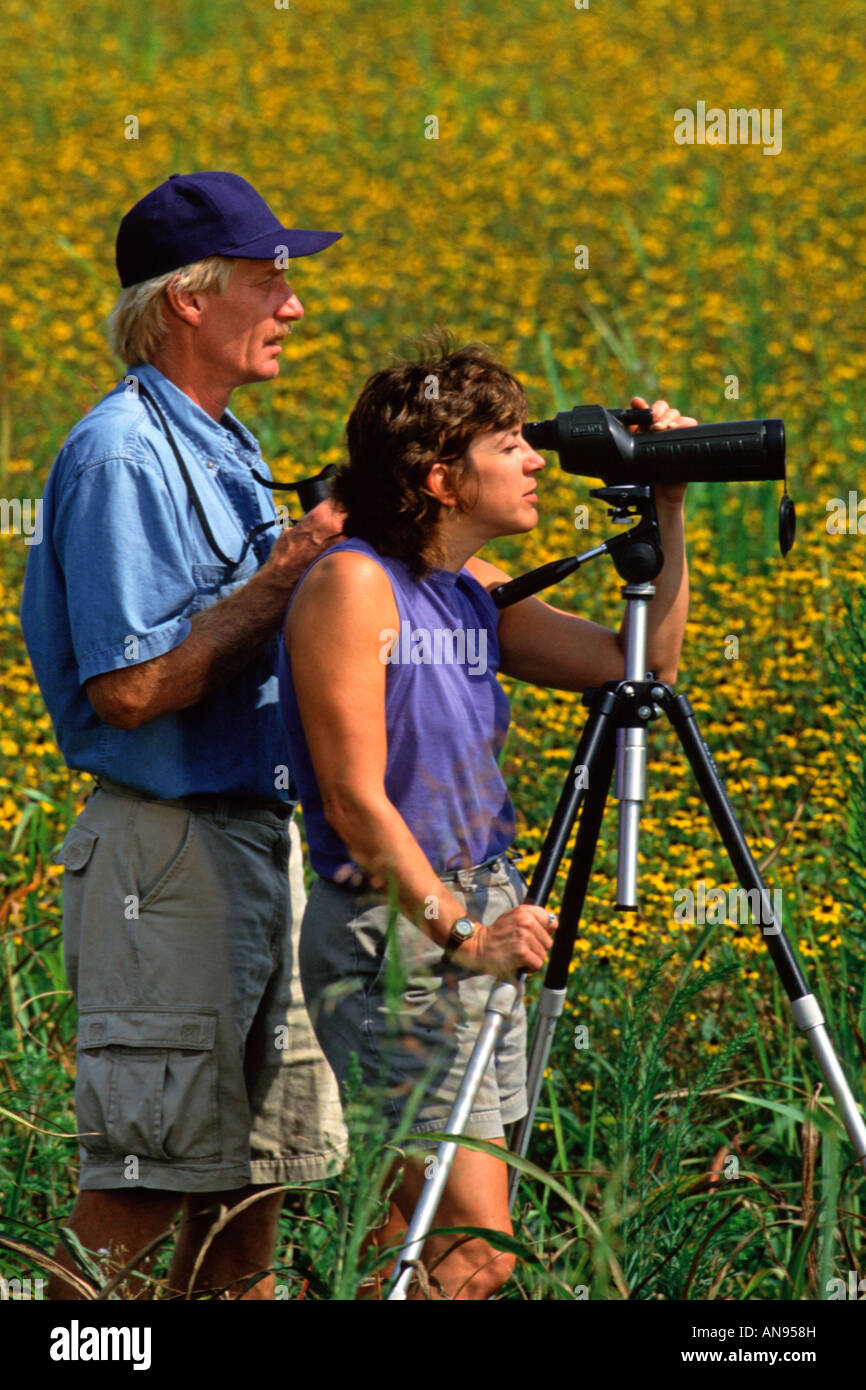 Birdwatchers with Spotting Scope - Vertical Stock Photo