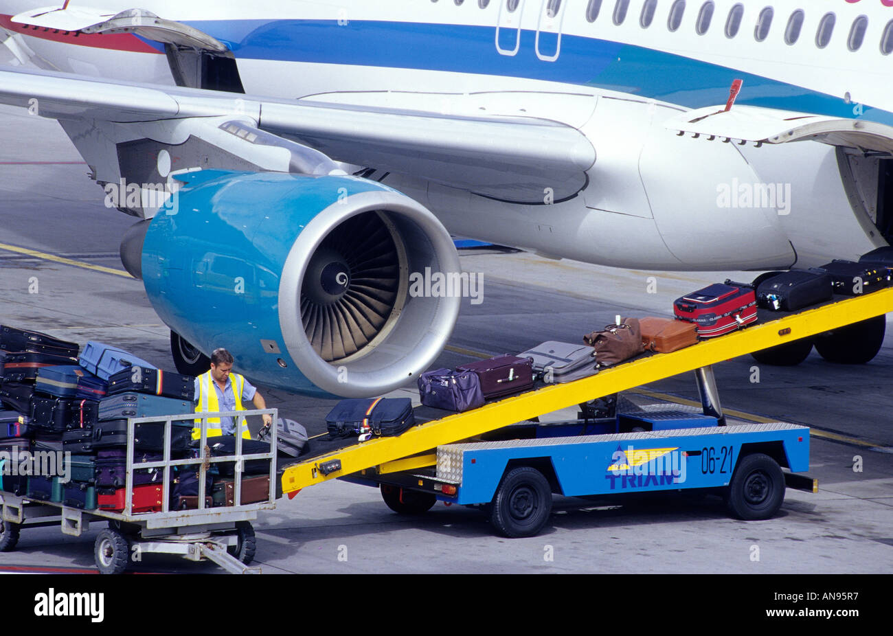 Airport staff loading airplane with baggage. Funchal, Madeira Stock
