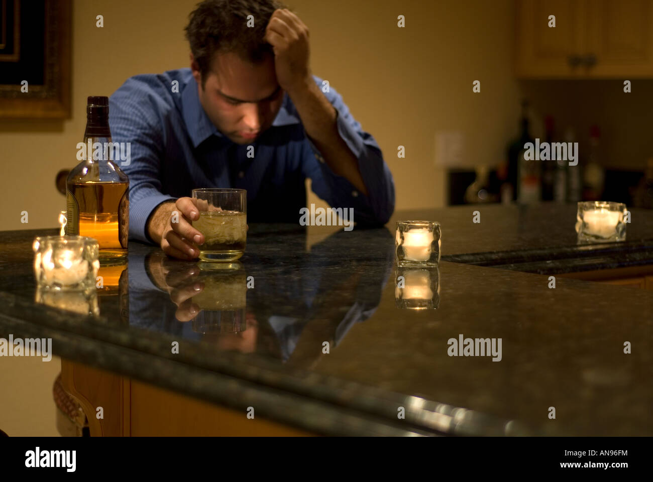 young man drinking and feeling despair Stock Photo Alamy