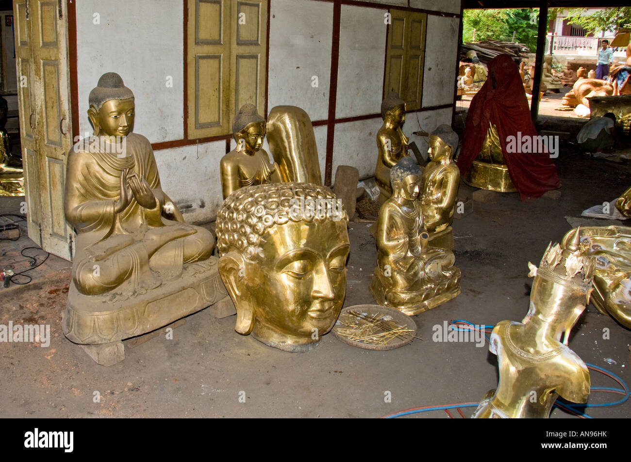 Freshly cast bronze Buddha statues from a foundry in Amanapura, Burma. Stock Photo