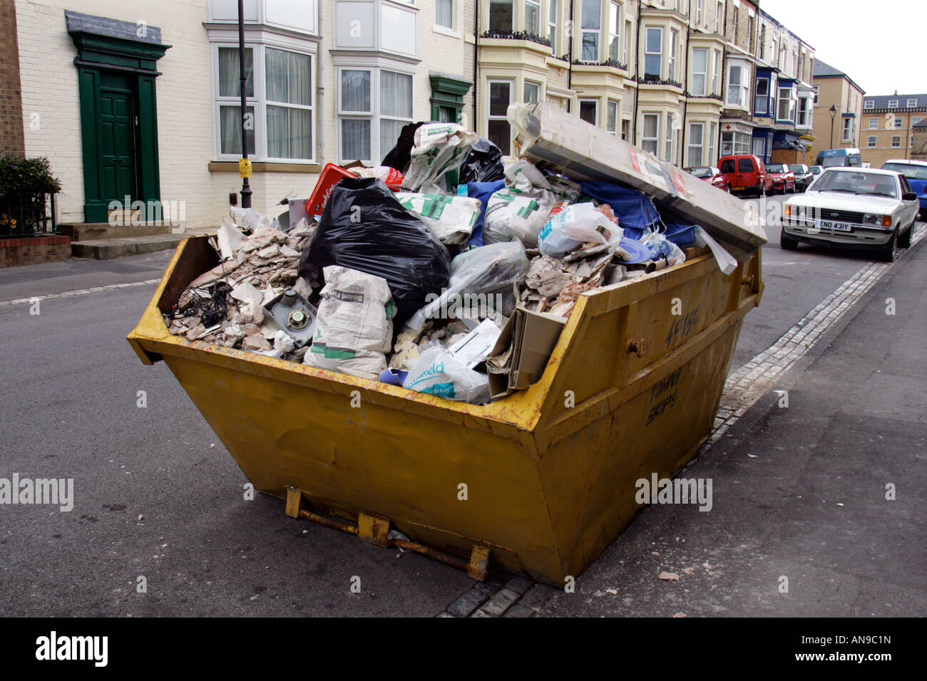 Waste destined for a landfill site loaded on a skip in uk street Stock Photo