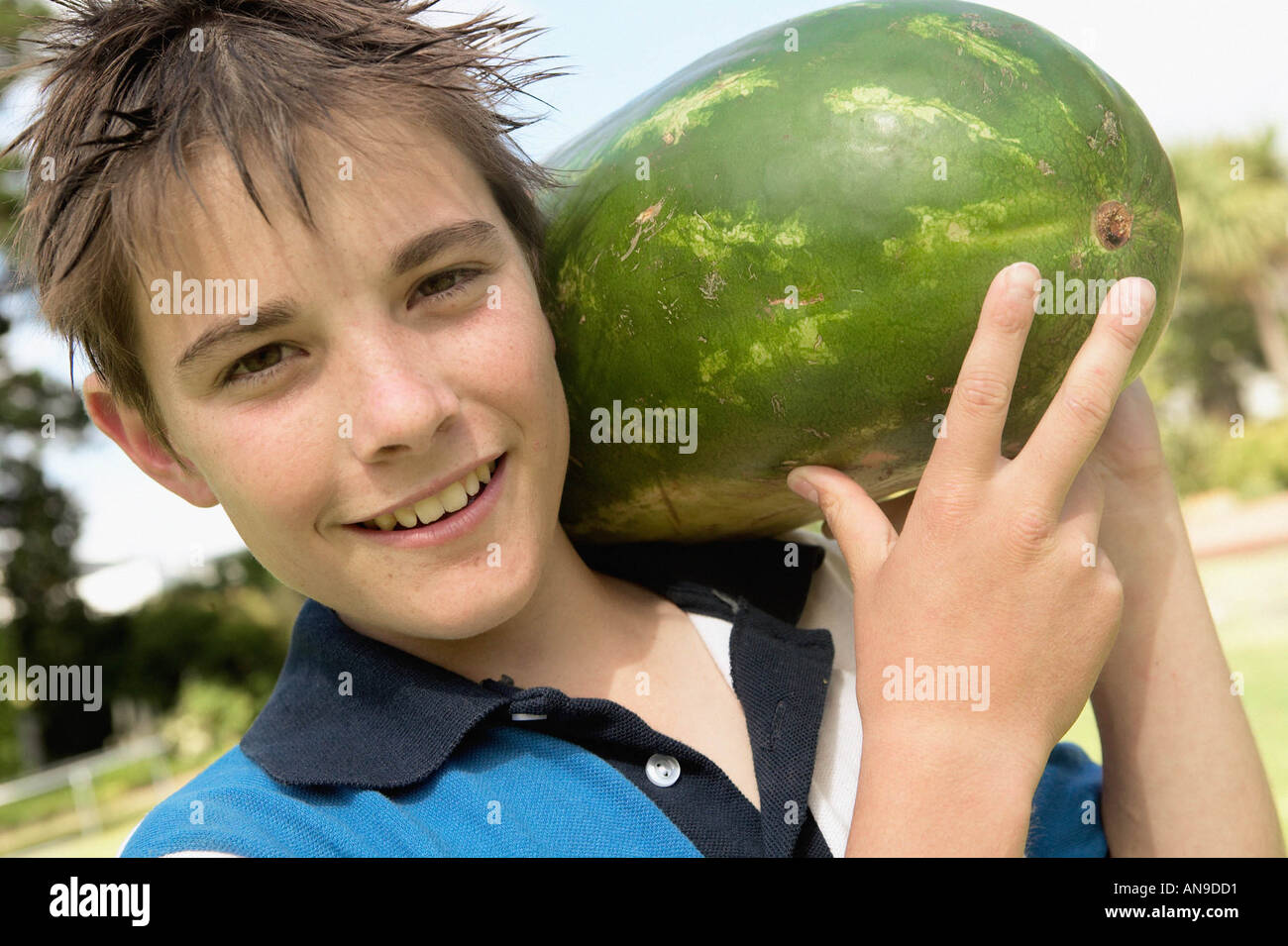 Smiling boy with water melon Stock Photo