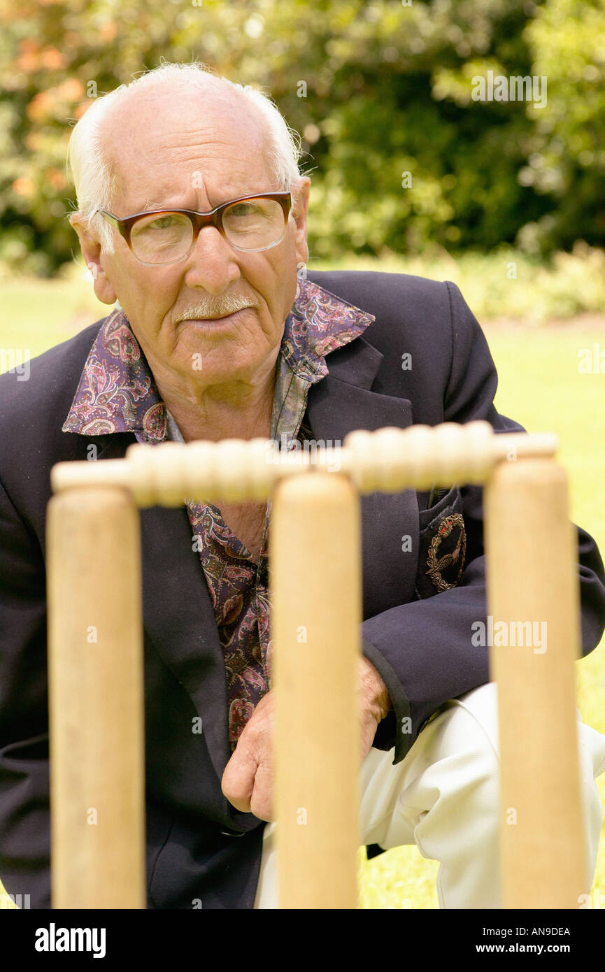 Senior man and cricket stumps Stock Photo