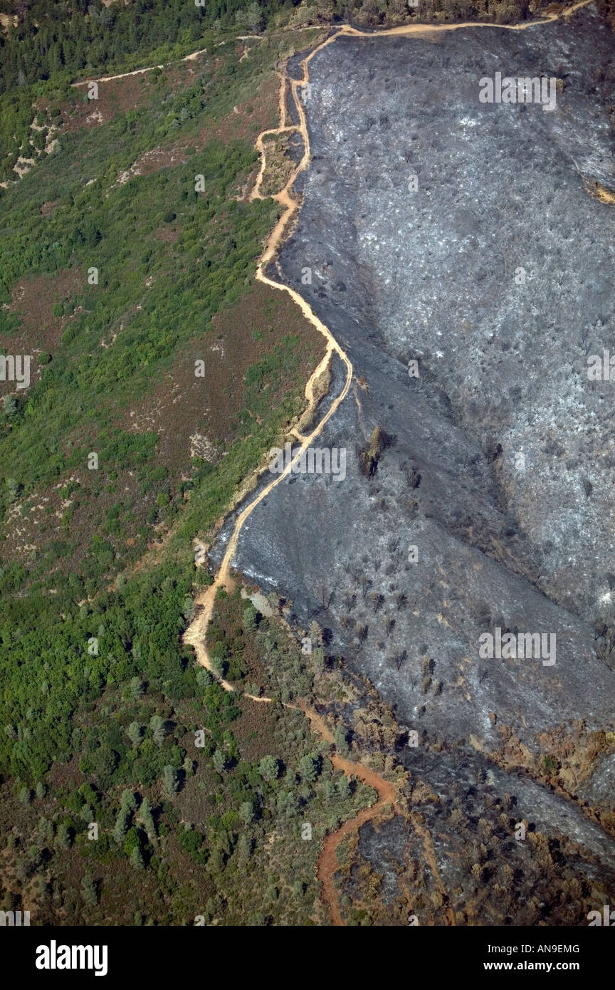 aerial view above Geysers fire burn mark up to crest Sonoma county mountains California Stock Photo