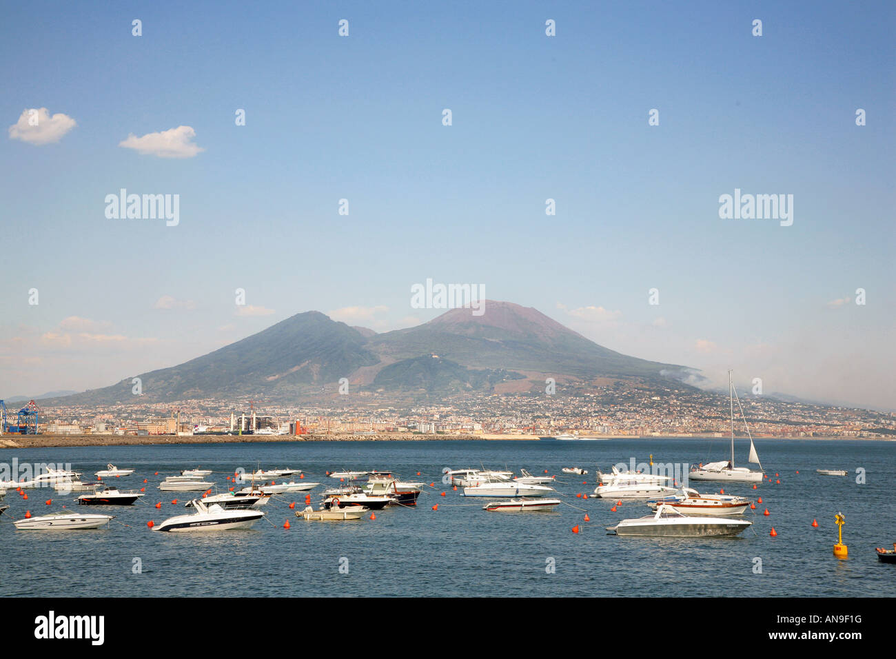 Boats moored in the bay of Naples with Vesuvius in the background Naples Italy Stock Photo