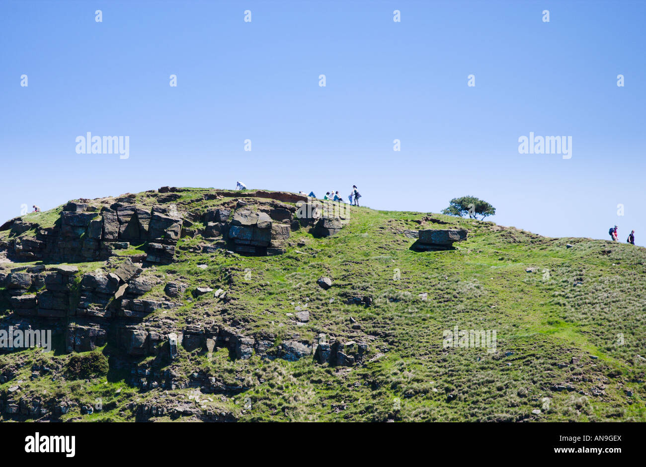 Walkers Silhouetted On The Summit Of Back Tor Ridge Walking Down A ...