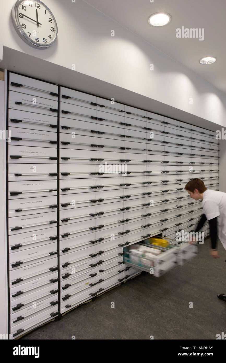 Pharmacist searching for medications Stock Photo