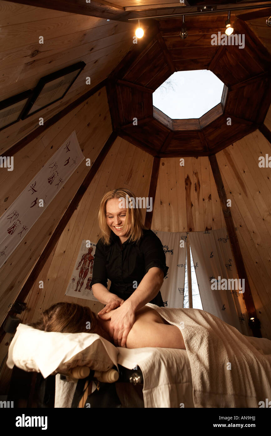 Woman getting massage on vacation, Kiruna, Sweden Stock Photo