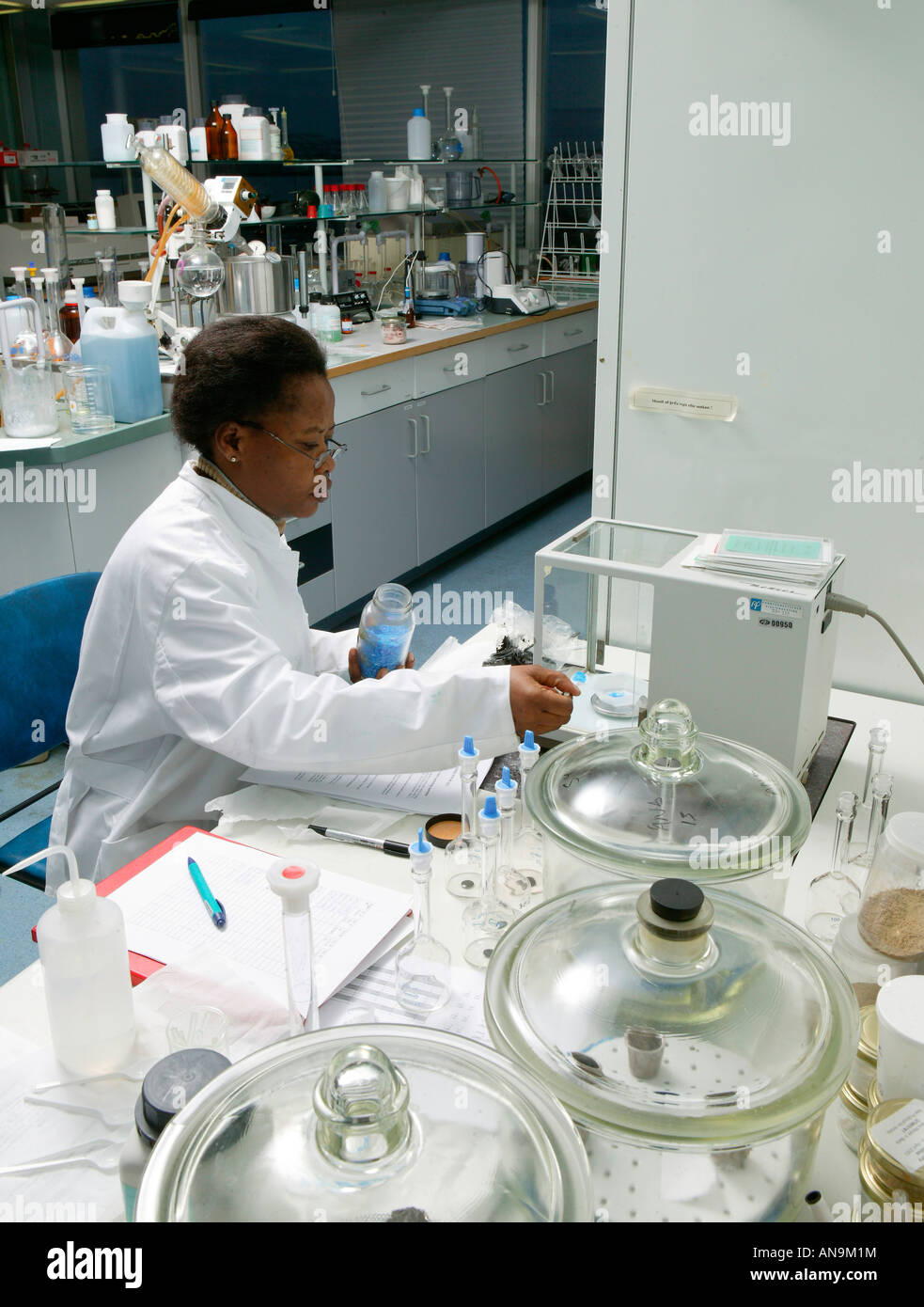 Researcher at Fish Lab with Sample Stock Photo Alamy