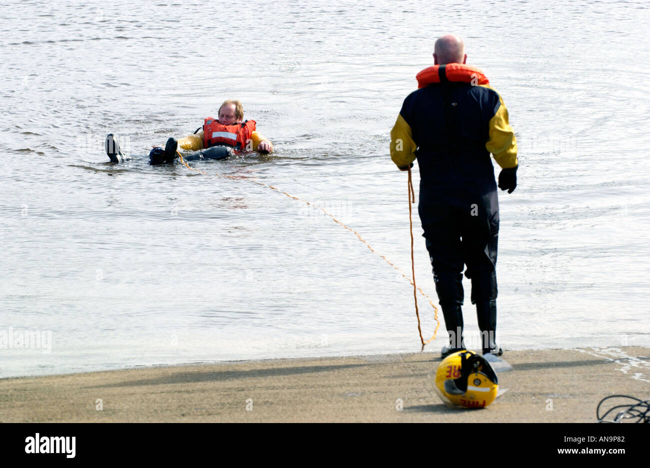 Firefighters on lifesaving drill in water at Swansea Marina South Wales ...