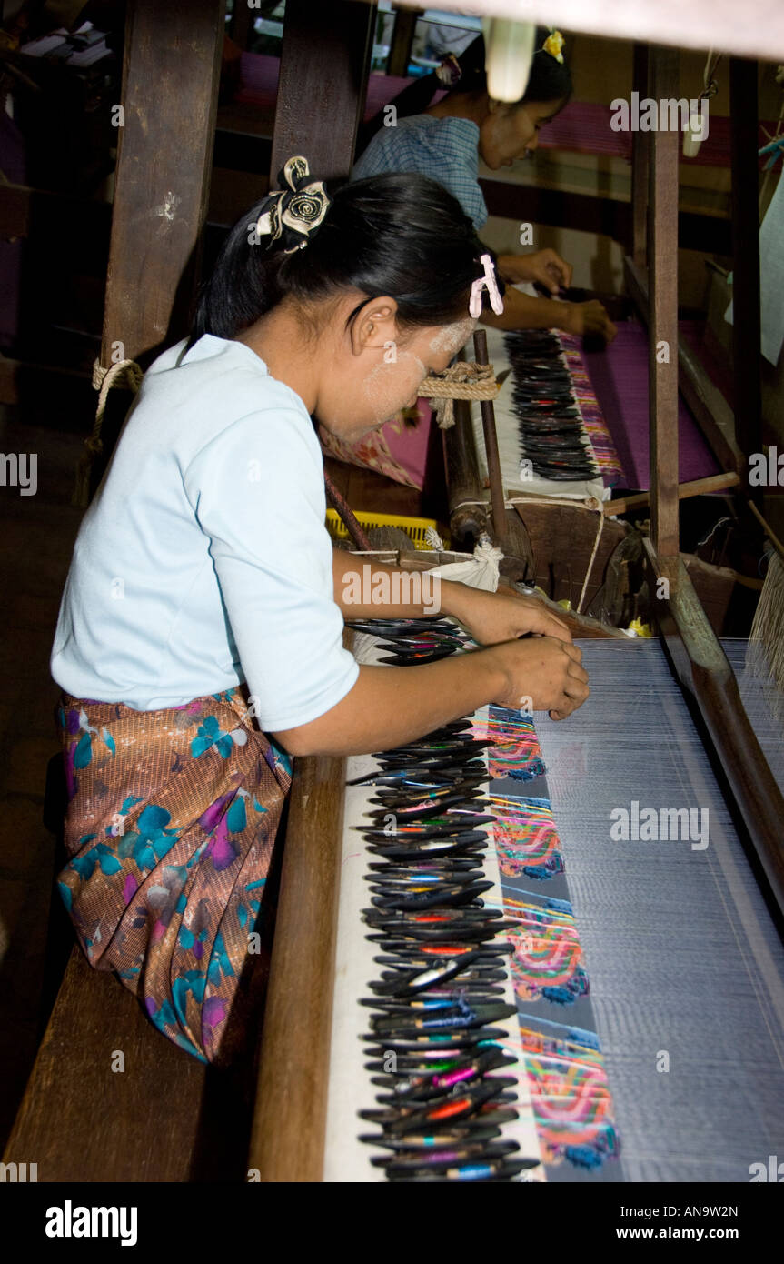 Woman weaving Burmese Silk on loom in workshop Amarapura Burma Stock Photo