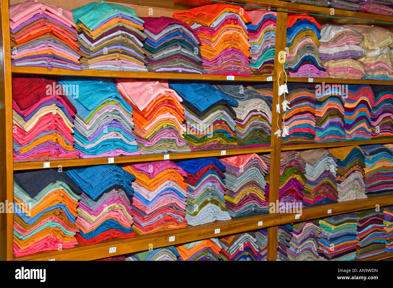 Burmese Silk fabrics on display in the Thein Nyo Silk Weaaving workshop in Amarapura Burma Stock Photo