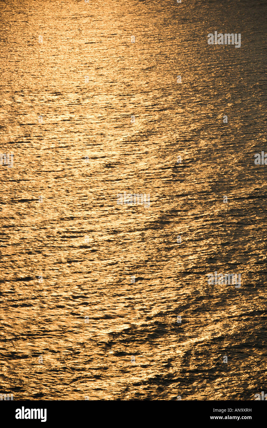 Sun reflecting golden on Atlantic ocean Stock Photo - Alamy