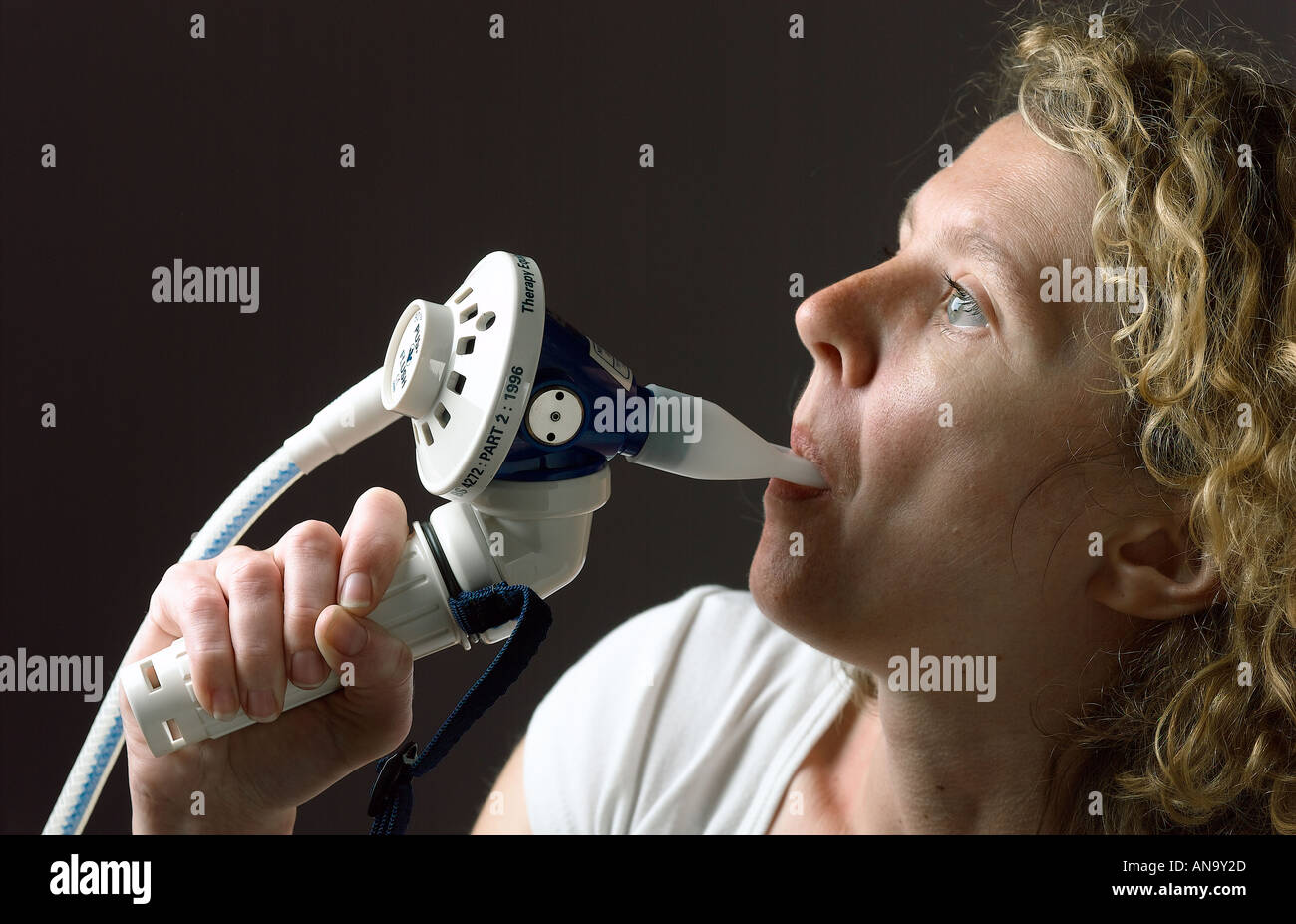 young woman using gas and air for pain relief Stock Photo
