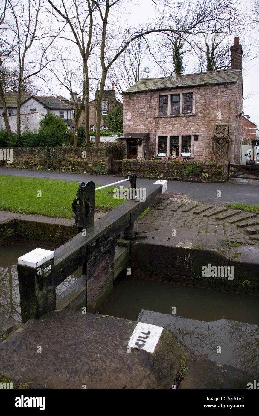 Lock gate and lock keeper's cottage at Marple locks in Cheshire Stock Photo