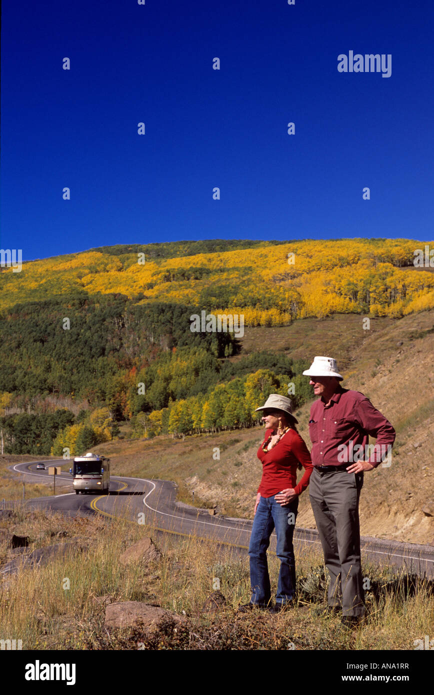 Couple in fall along highway in Fish Lake Mountains Utah USA. Stock Photo