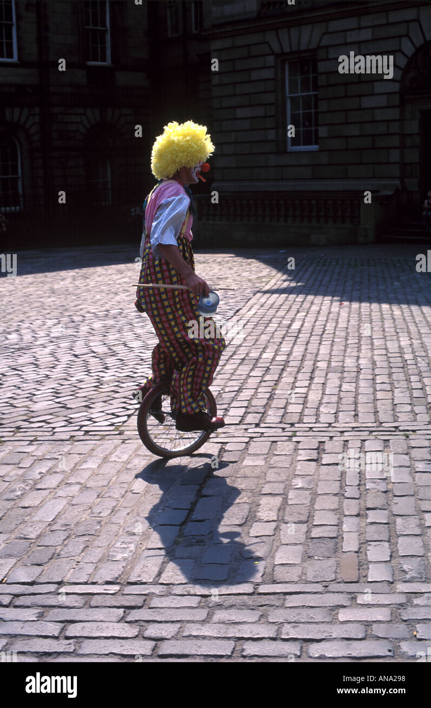 clown on unicycle Edinburgh Fringe Festival Stock Photo