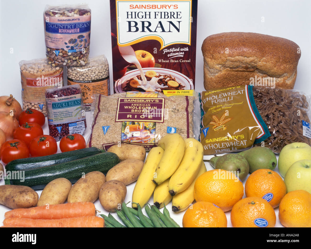 selection of food including fruit vegetables pulses rice bread  cereal Stock Photo