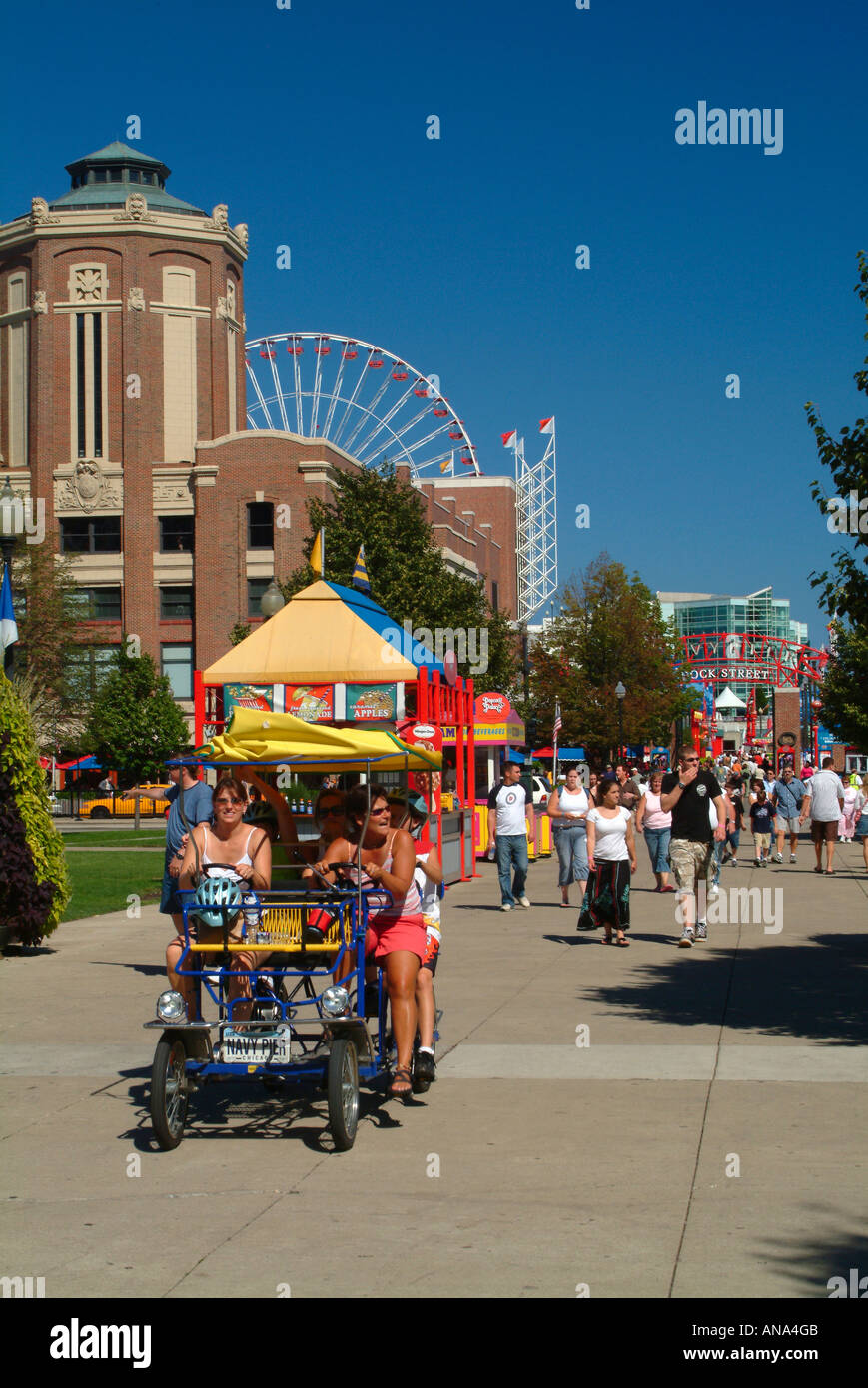 Tourists on Four Wheeled Bicycle on Navy Pier in Downtown Chicago Stock